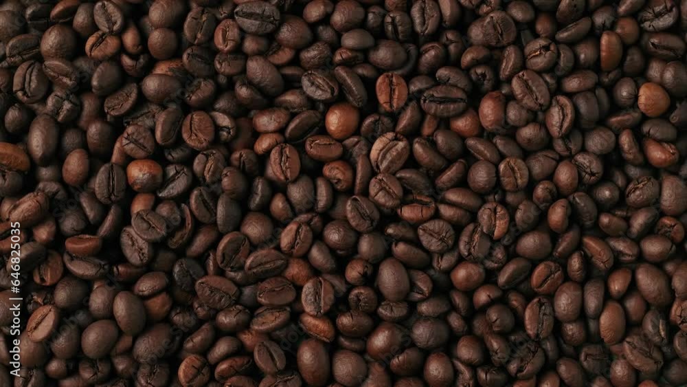 Closeup shot of aromatic roasted coffee beans being blowed out from the green background. Chroma Key. Closeup shot of aromatic roasted coffee beans being blowed out from the green background. Chroma Key.