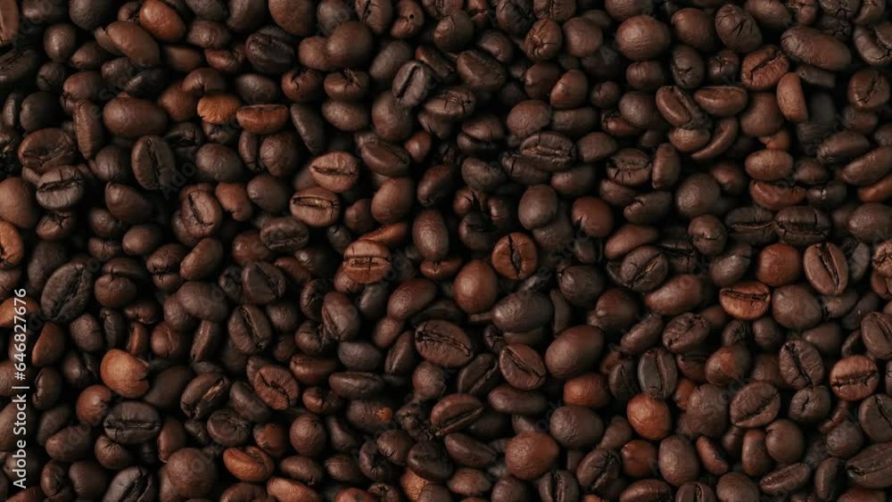 Closeup shot of female hand taking out the roasted coffee beans from the green background. Chroma Key. Closeup shot of female hand taking out the roasted coffee beans from the green background. Chroma Key.