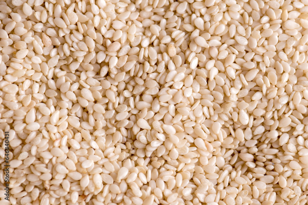 Sesame seeds. Textured background of seeds of Sesame very close up. Sesame seeds. Textured background of seeds of Sesame very close up.
