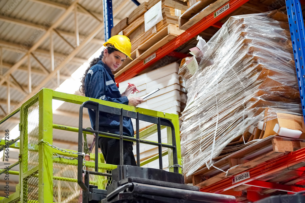 Warehouse Industrial supply chain and Logistics Companies inside. Warehouse workers checking the inventory. Products on inventory shelves storage. Worker Doing Inventory in storehouse. Warehouse Industrial supply chain and Logistics Companies inside. Warehouse workers checking the inventory. Products on inventory shelves storage. Worker Doing Inventory in storehouse.