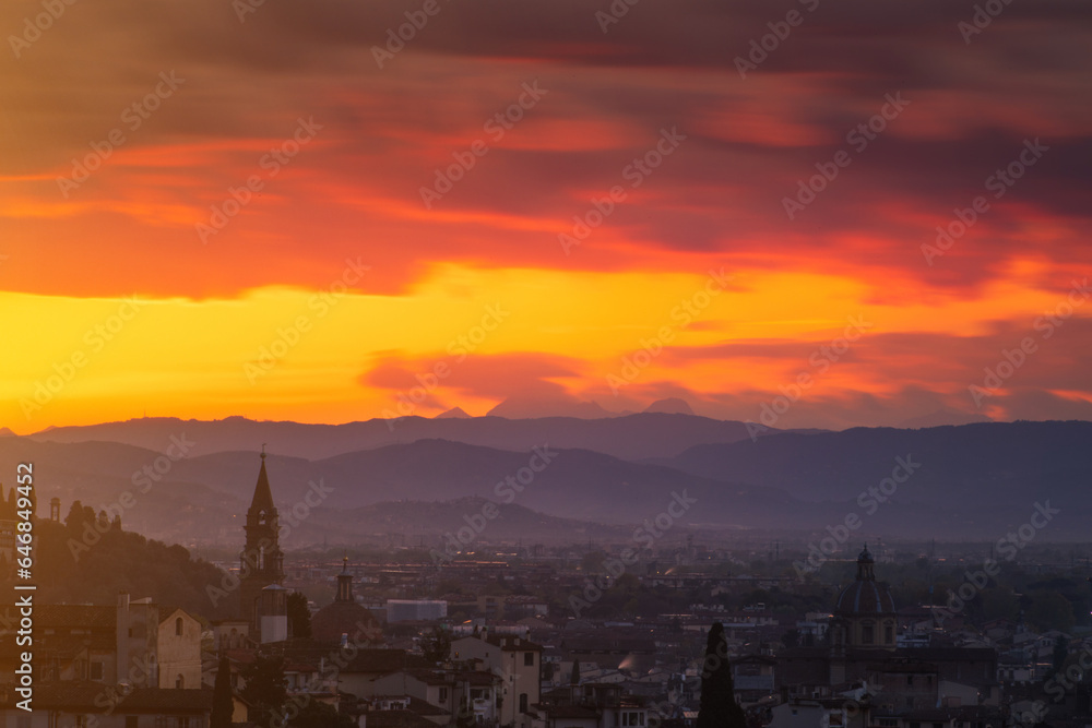 The city of Florence and the Apennines seen from above at the sunset