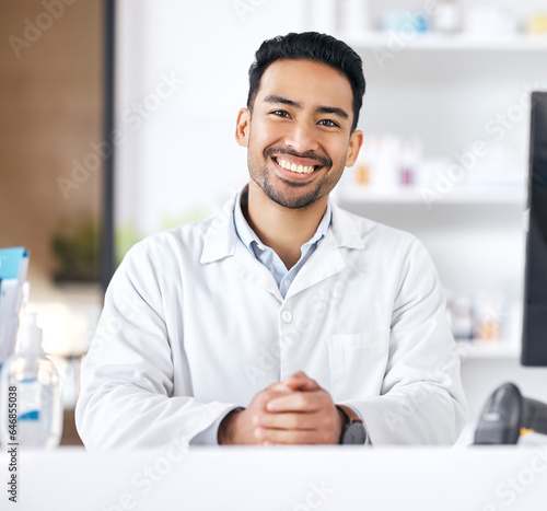 Man, pharmacy and portrait with happy and smile of pharmacist ready for healthcare support and work. Clinic, doctor and male professional with career confidence and medicine for medical job at desk