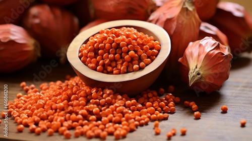 Vibrant Annatto Seeds in wooden Table with Generative AI photo