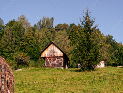 Old authentic wood house hayloft Carpathian mountains Ukraine Europe. Local countryside travel hiking trails Cottagecore