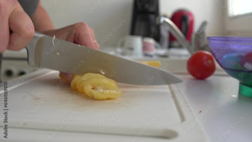 Cutting vegetables for preparing salad Cutting vegetables for preparing salad