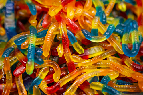 Candy background, chewing jelly candies in the form of worms, close-up.