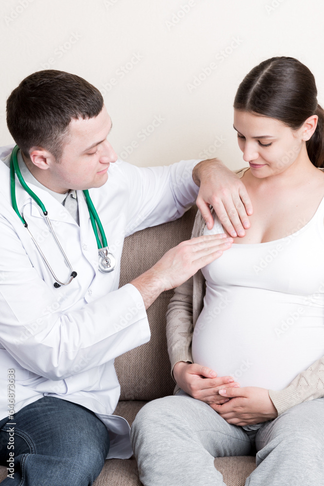 Doctor is checking pregnant woman's breast Health problems during pregnancy concept Doctor is checking pregnant woman's breast Health problems during pregnancy concept