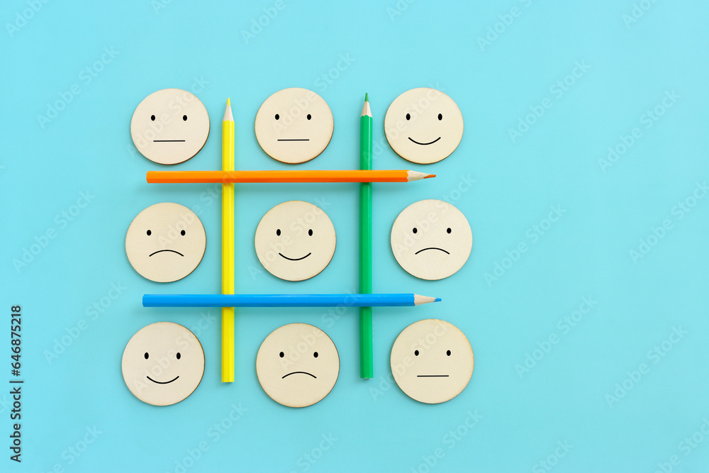 Top view image of pencils with of happy and sad face. concept of happiness emotion and satisfaction Top view image of pencils with of happy and sad face. concept of happiness emotion and satisfaction