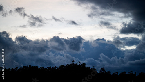 The sky is overcast. Clouds are forming and rain is falling.