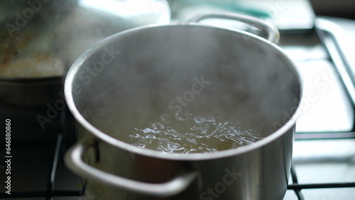 Close-up of boiling water inside large pan, preparing food