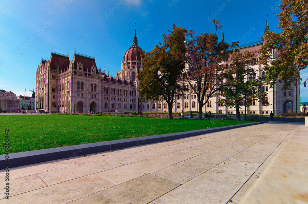 Picturesque panoramic view of Hungarian Parliament Building against blue sky. One of the most beautiful buildings in Budapest. Travel and tourism concept