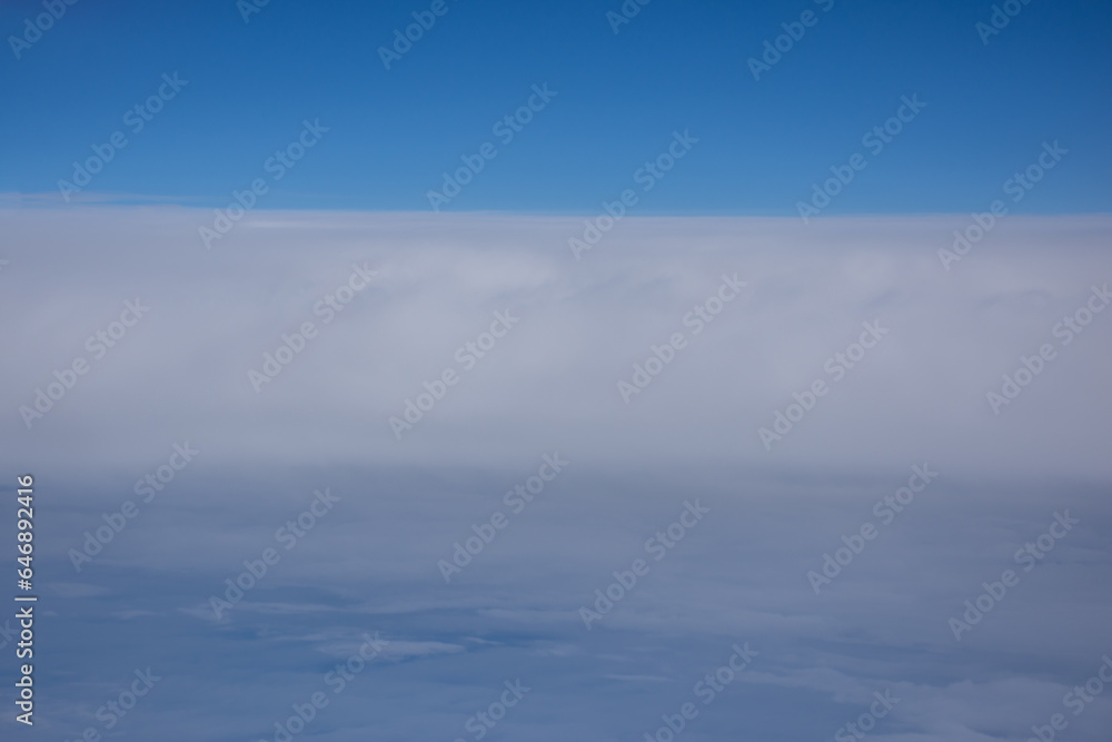 A perfect horizon between clouds and clear skies A perfect horizon between clouds and clear skies