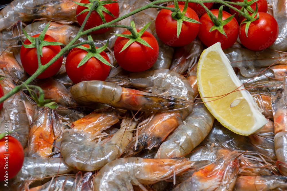Fresh shrimp with a slice of lemon and cherry tomatoes