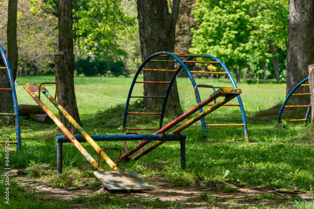 A very old playground with a swing A very old playground with a swing