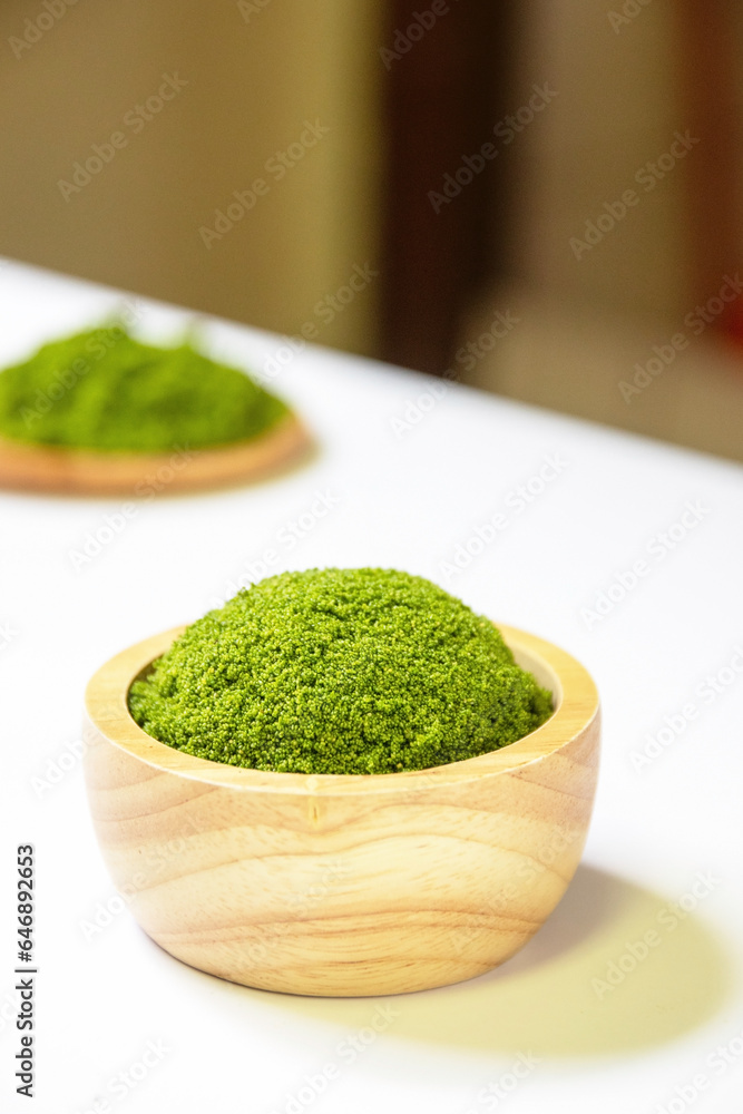 Wolffia globosa in wooden bowl. Wolffia is the nutrient-rich plant-based source of protein and omega3 and vital minerals like zinc, calcium, iron, B12 and so much more. Wolffia globosa in wooden bowl. Wolffia is the nutrient-rich plant-based source of protein and omega3 and vital minerals like zinc, calcium, iron, B12 and so much more.