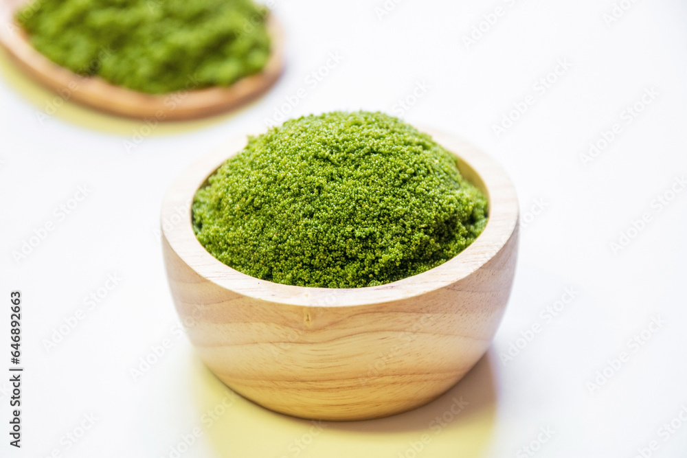 Wolffia globosa in wooden bowl. Wolffia is the nutrient-rich plant-based source of protein and omega3 and vital minerals like zinc, calcium, iron, B12 and so much more. Wolffia globosa in wooden bowl. Wolffia is the nutrient-rich plant-based source of protein and omega3 and vital minerals like zinc, calcium, iron, B12 and so much more.