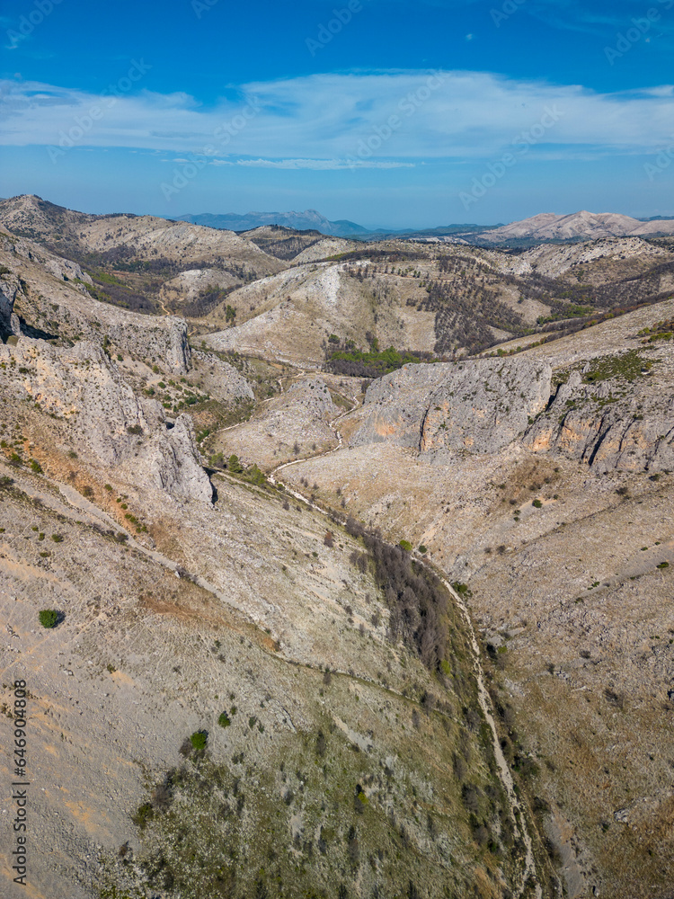 Aerial view of Malafi ravine in Serra D'Alfaro with burnt wooded area on the mountains, Tollos village, Alicante, Costa Blanca, Spain- stock photo