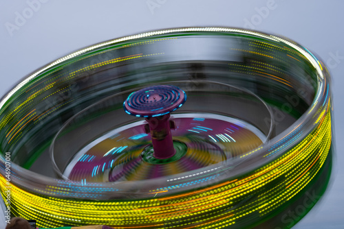 Картината върху платно zero gravity ride at local fair or carnival at night long time exposure creating