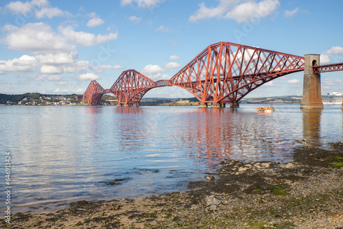 The Forth Bridge is a railway bridge across the Firth of Forth in Scotland. Is considered a symbol of Scotland, and is a UNESCO World Heritage Site. Designed by Sir John Fowler and Sir Benjamin Baker