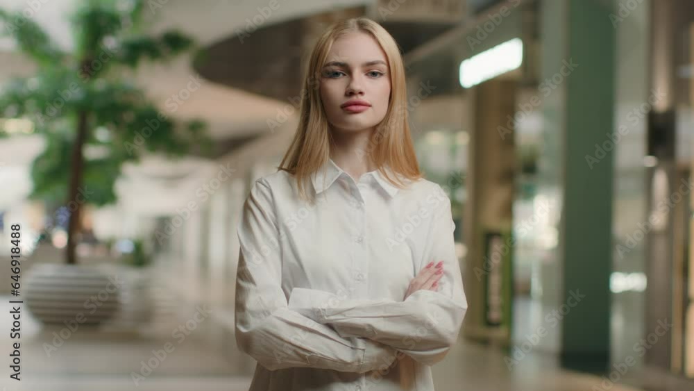Caucasian businesswoman portrait confident woman with crossed hands posing in shopping mall indoors business center serious girl female employer manager company owner folded arms feminine independence Caucasian businesswoman portrait confident woman with crossed hands posing in shopping mall indoors business center serious girl female employer manager company owner folded arms feminine independence
