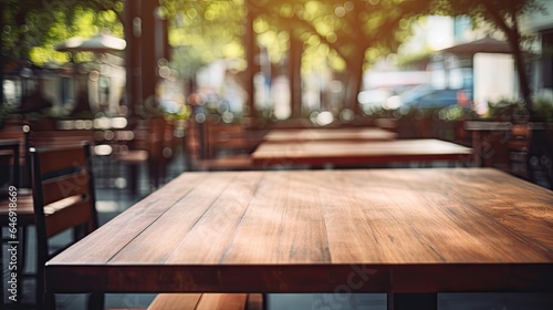 Blurry wood outdoor restaurant table and chair.