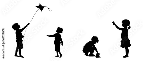 Children silhouettes playing outdoor. photo