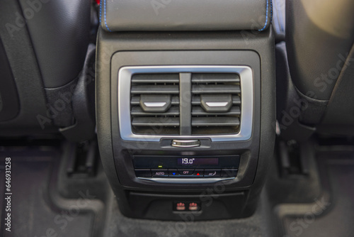 Close-up view of rear dual-zone climate control of new car.  © Alex