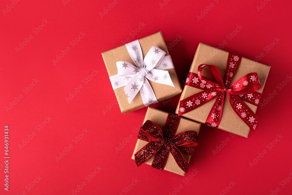 Christmas gift boxes with red balls on red background. Christmas gift boxes with red balls on red background.