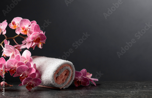 Beautiful blooming orchid flowers with towels.