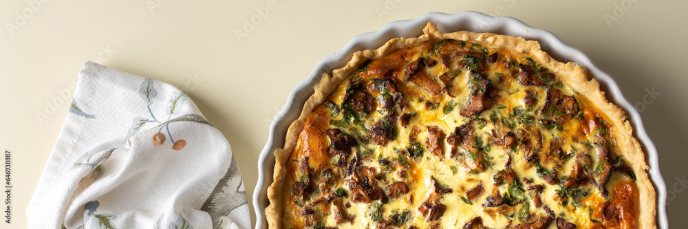 Homemade quiche with seasonal forest mushrooms Chanterelles in a round shape on a yellow background, banner with pie - obrazy, fototapety, plakaty 