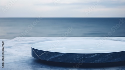 Round Marble Podium in navy Colors in front of a blurred Seascape. Luxury Backdrop for Product Presentation 