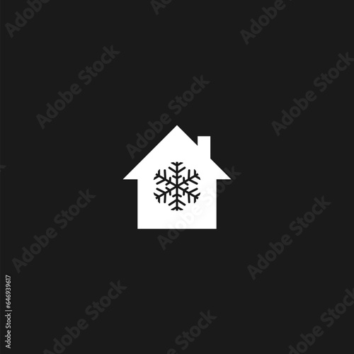 Snowflake and house icon isolated on black 
