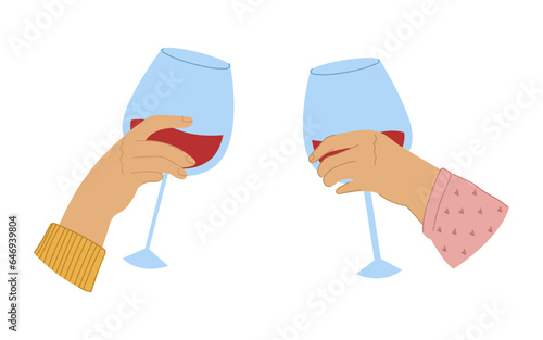 A couple celebrating and drinking red wine. Two hands with wineglasses.