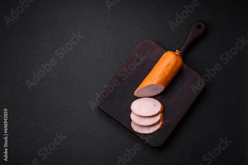 фотографія Delicious smoked chicken sausage with salt, spices and herbs