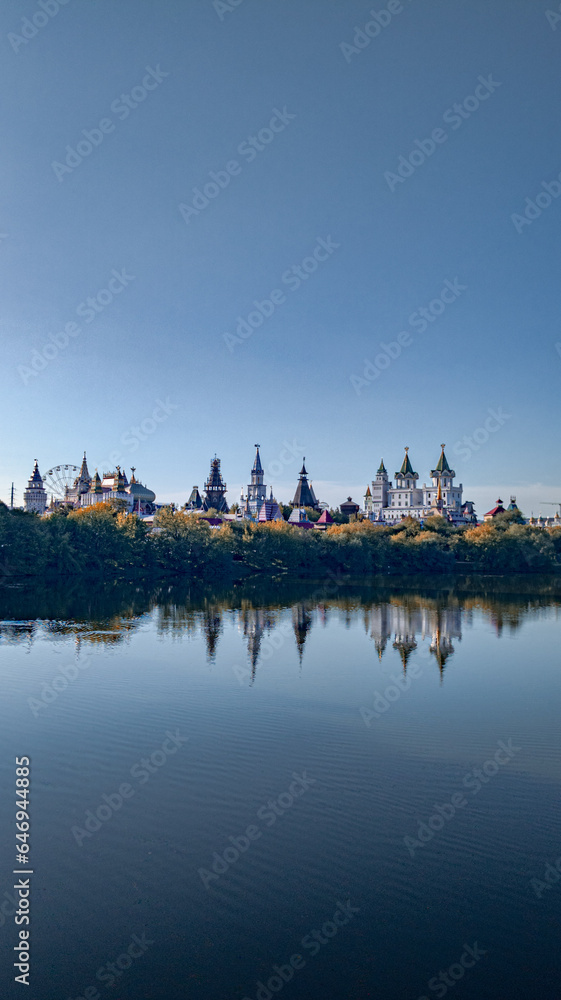 beautiful fairy-tale buildings against the backdrop of a summer lake