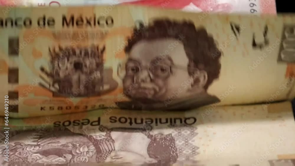 economy and finance with Mexican peso bills