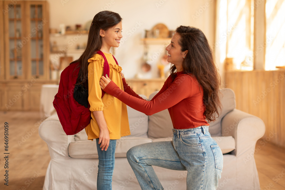 Arab Mother Preparing Daughter For School And Lessons At Home Arab Mother Preparing Daughter For School And Lessons At Home