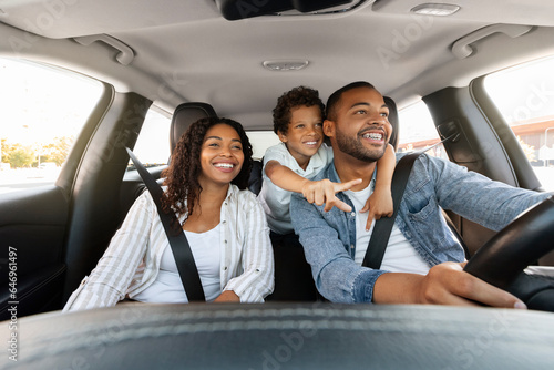 Beautiful african american family enjoying car trip together