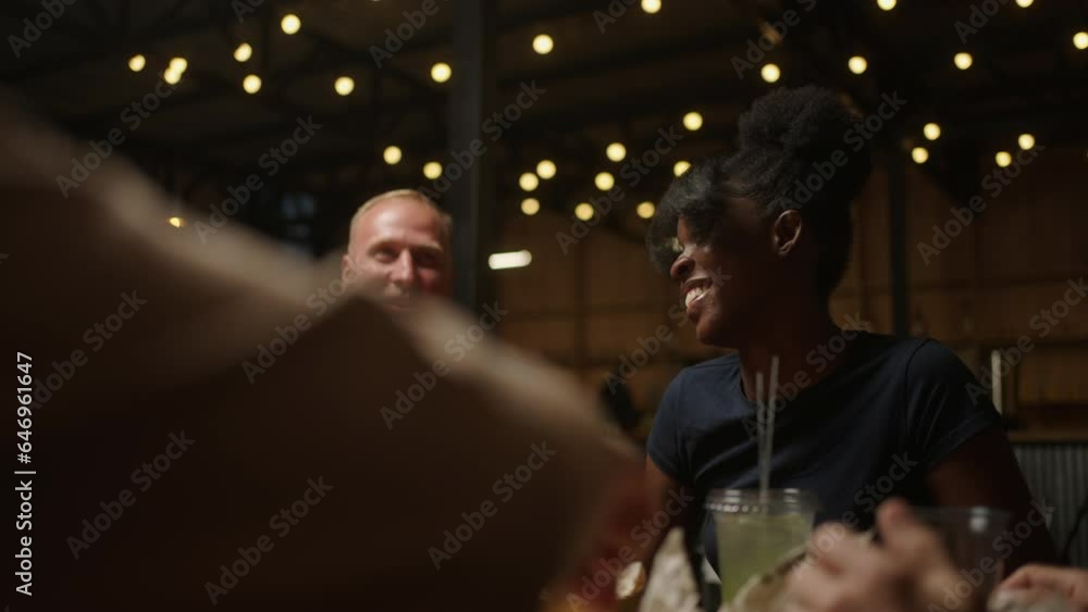 Happy Multiethnic People Communicating And Laughing In Friends Or Family Party In Saturday Evening Happy Multiethnic People Communicating And Laughing In Friends Or Family Party In Saturday Evening