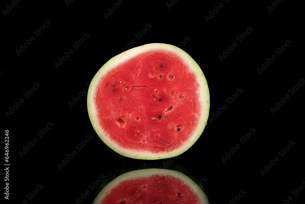half a red watermelon on a black background half a red watermelon on a black background