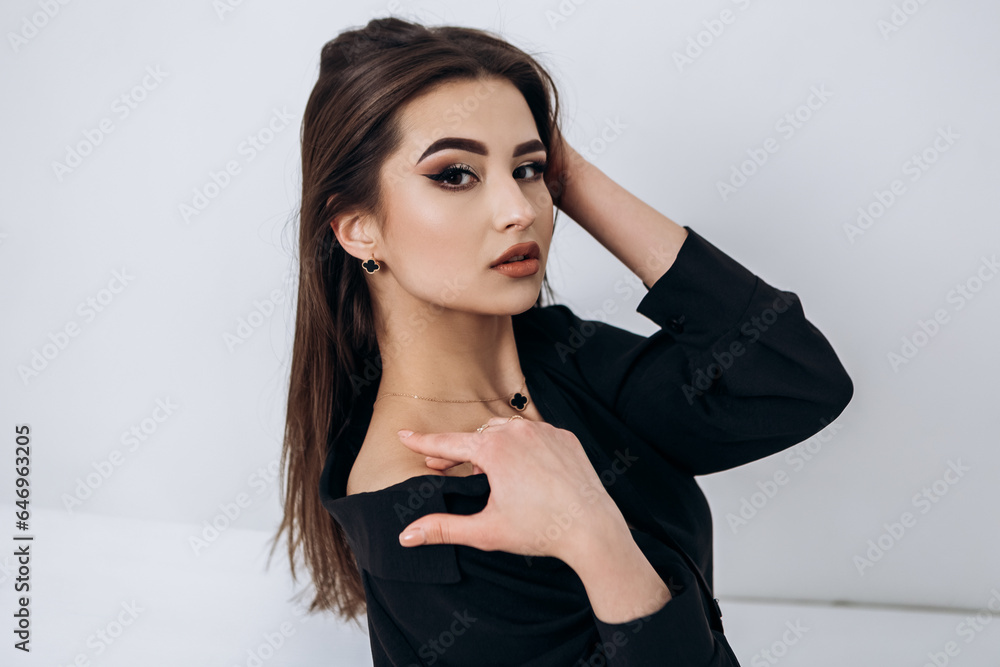 Fashion portrait of young pretty indian latin american woman posing in photo studio on white background. Hispanic lady, skin care, solarium, make up, cosmetology
