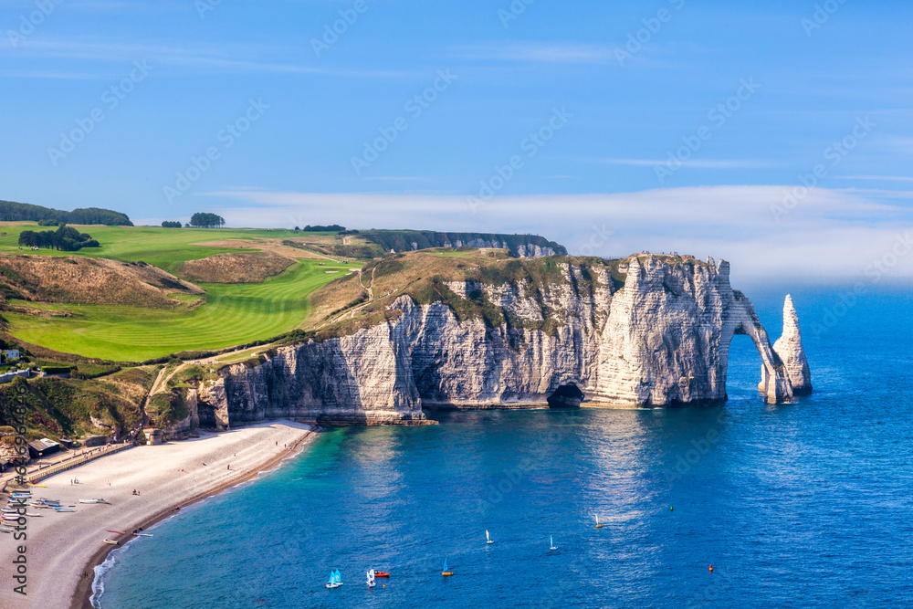 Etretat, Normandy France, the Beach, Needle and Aval Arch, on a fine summer afternoon. - obrazy, fototapety, plakaty 