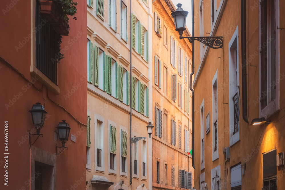 Bright, colourful residential buildings and architecture in Rione VI Parione in central old town of historic Rome, Italy.