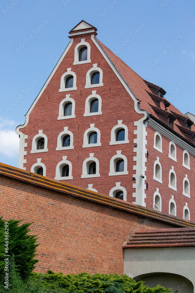 Decorative facade of Old Granary and defensive old City Walls, Torun, Poland