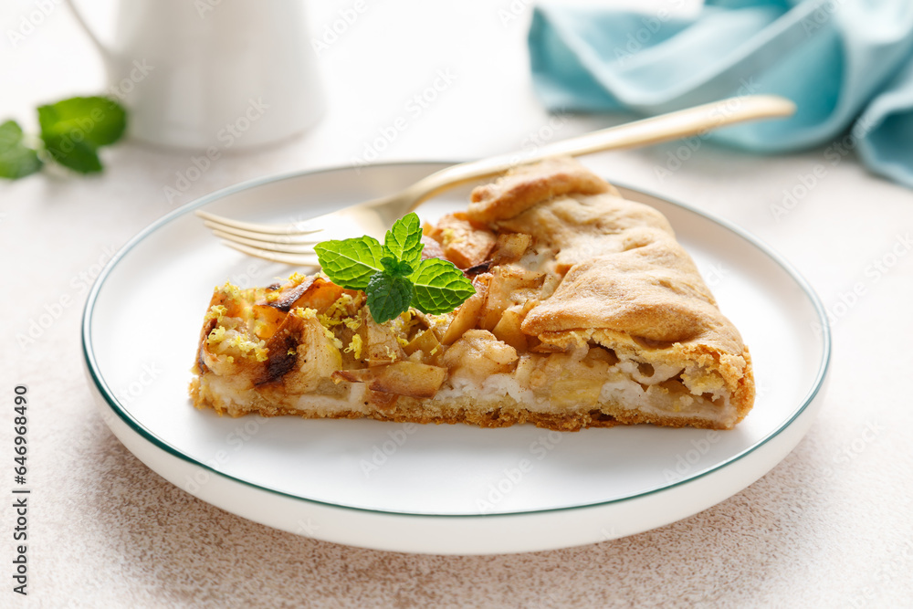 Apple pie slice with cinnamon and lemon zest on a plate Apple pie slice with cinnamon and lemon zest on a plate