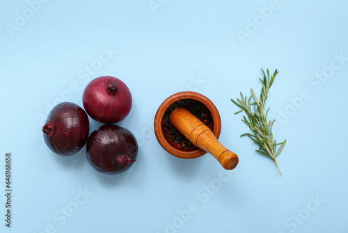 Fresh red onions, wooden mo...