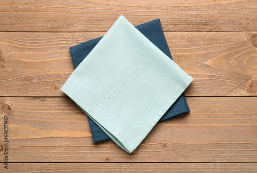 Two folded linen napkins in...