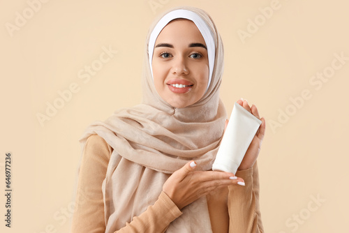 Young Muslim woman with tub...