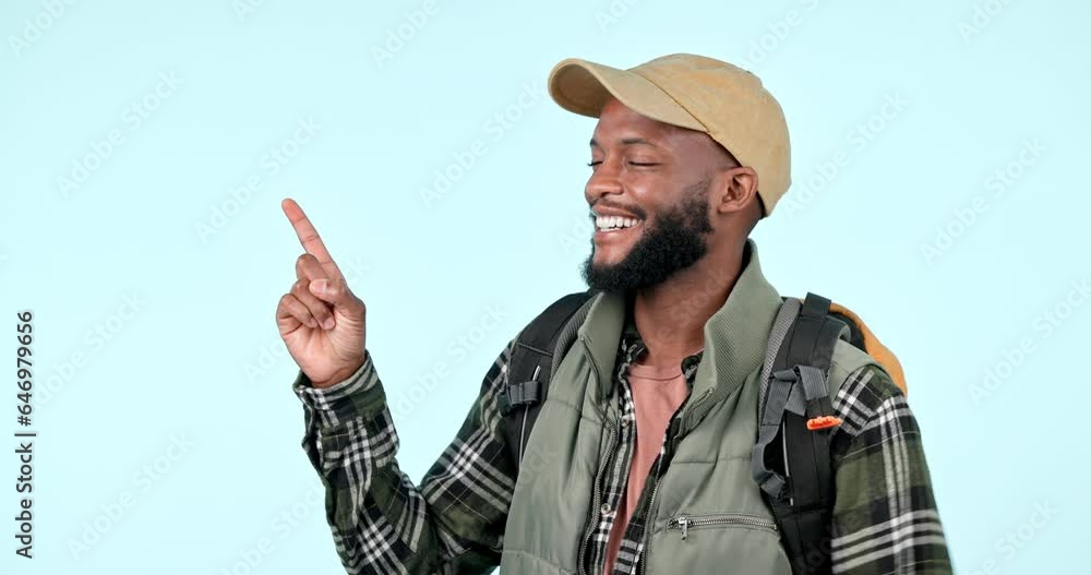 Happy, hiking and man pointing hands in direction of adventure, camping and holiday with backpack in studio. Mockup, smile and person show destination to nature trail or wood for freedom and travel Happy, hiking and man pointing hands in direction of adventure, camping and holiday with backpack in studio. Mockup, smile and person show destination to nature trail or wood for freedom and travel
