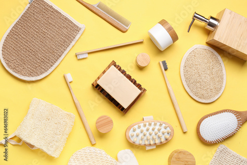Composition with cosmetic products and bath supplies on yellow background